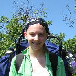 A teenage girl wearing an external-frame backpack