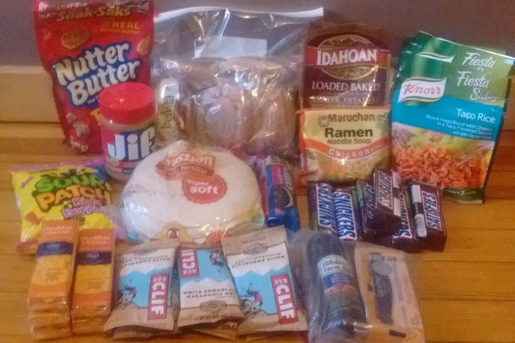 An assortment of junk food, tortillas, and snacks.