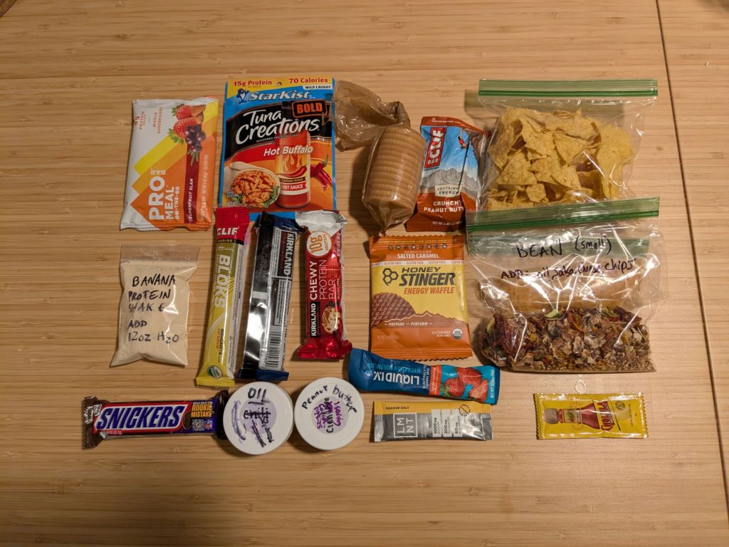 backpacking food laid out on a table