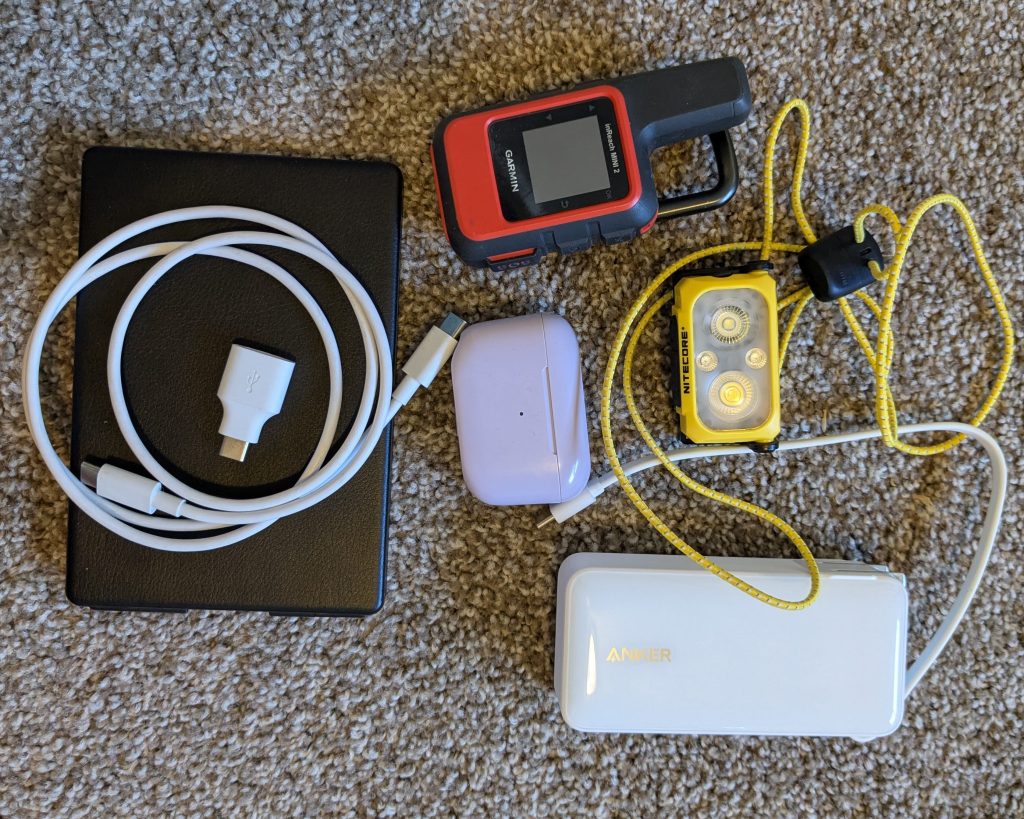 headlamp, plb, earbuds, and other electronics